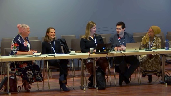 Five panelists discuss in front of an audience at Workshop number 111 of 2019's IGF